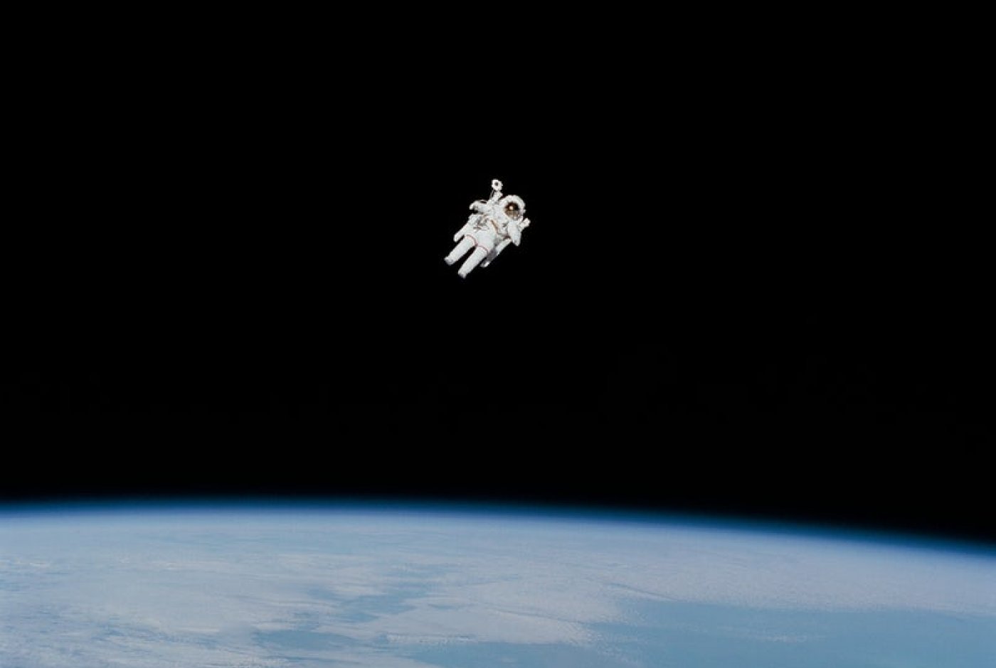 An astronaut and Earth