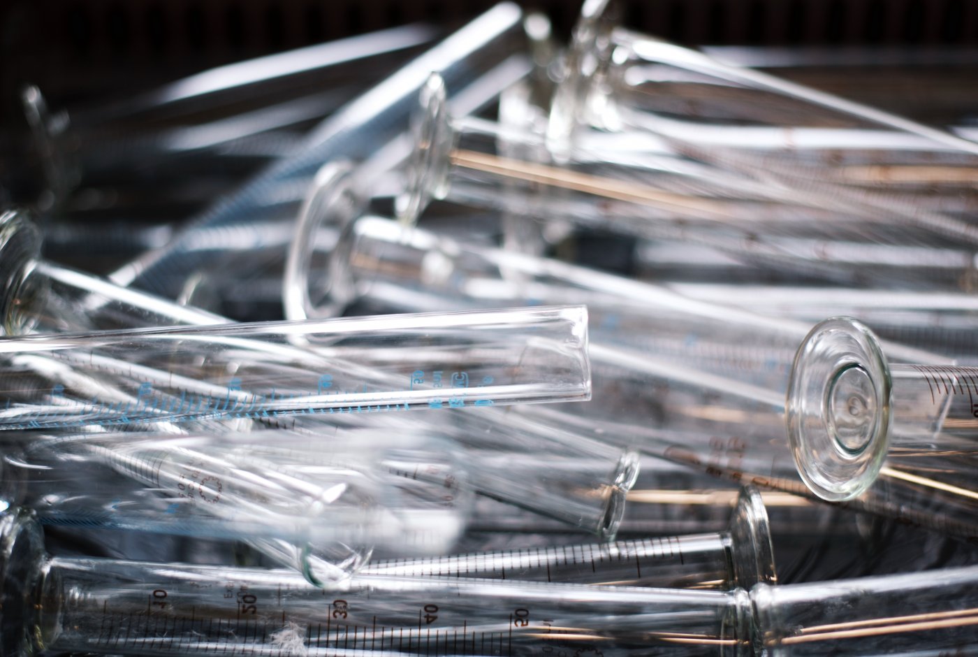 a bunch of test tubes in a pile