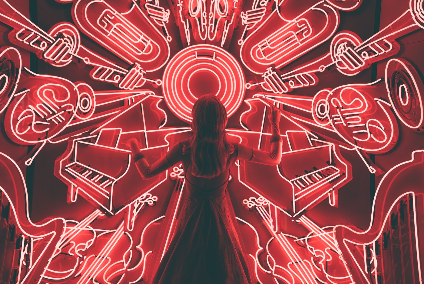 shows a woman conducting madness of music around her