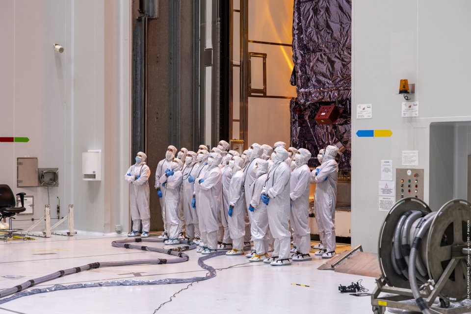 researchers observing the telescope