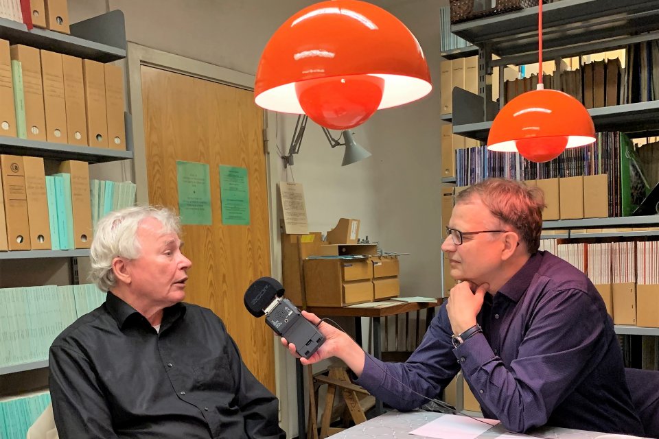 a man interviewing another man