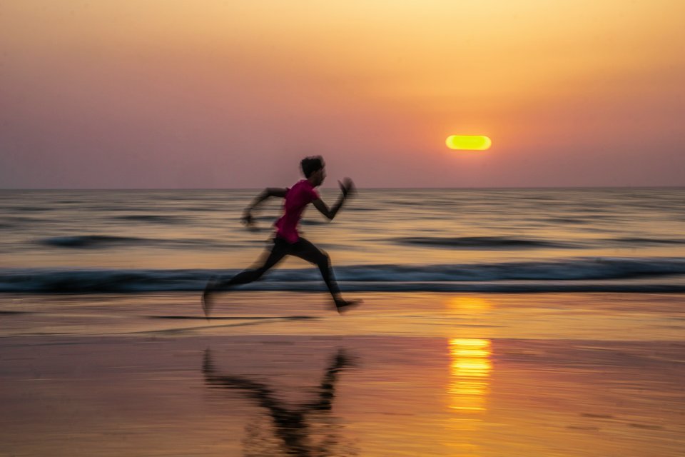 man running on beach